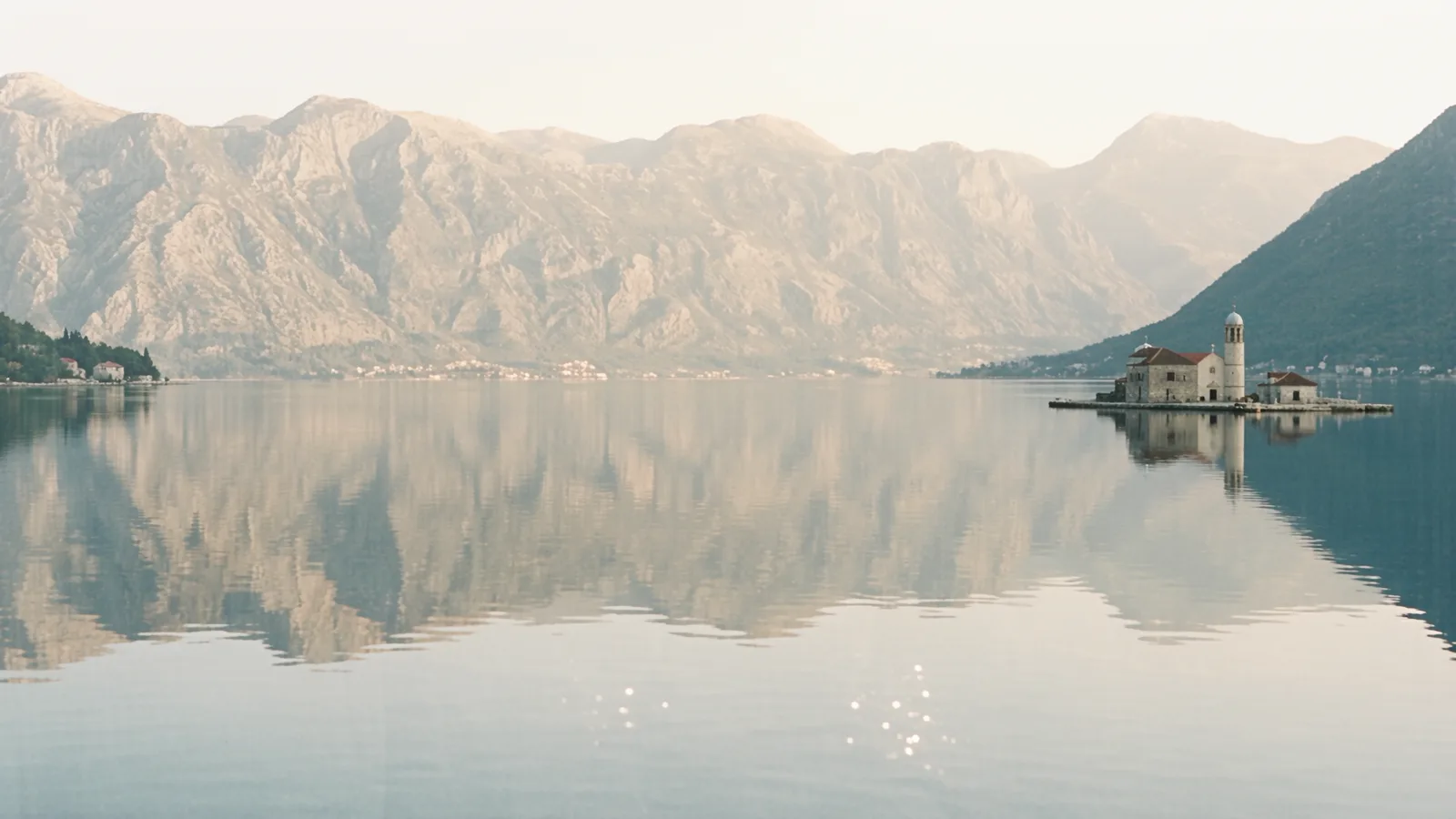 The calm Bay of Kotor at dawn, seen through the practice window.